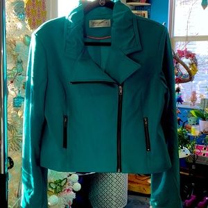 Cropped teal motorcycle jacket zipper detail